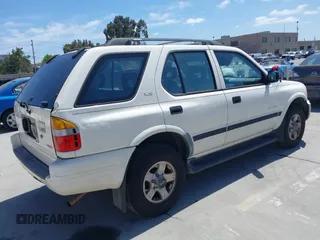 1999 Isuzu Rodeo S z VIN 4S2CM58WXX4347611, wystawiony jako IAAI lot #42351641 z przebiegiem 256 007 mil mil oraz . Historia ofert i sprzedaży dostępna na DreamBid. Obrazek 4.