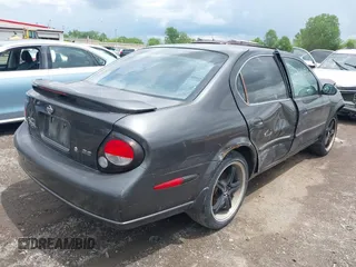 2001 Nissan Maxima GLE z VIN JN1CA31A31T112426, wystawiony jako IAAI lot #42248865 z przebiegiem Nie podano mil oraz . Historia ofert i sprzedaży dostępna na DreamBid. Obrazek 4.