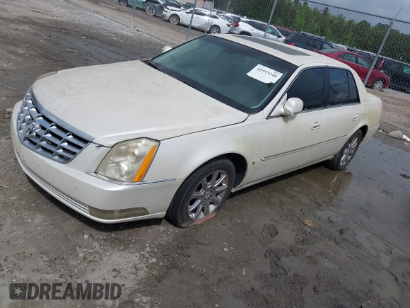 2008 Cadillac DTS 1SD z VIN 1G6KD57Y28U112764, wystawiony jako IAAI lot #41953240 z przebiegiem Nie podano mil oraz . Historia ofert i sprzedaży dostępna na DreamBid. Obrazek 2.