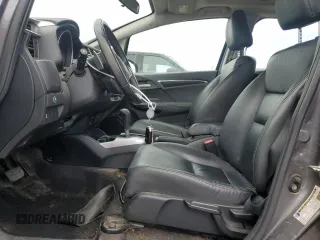 2015 Honda Fit EX-L z VIN 3HGGK5H8XFM776885, wystawiony jako Copart lot #57298225 z przebiegiem Nie podano mil oraz Szkoda całkowita • Salvage title. Historia ofert i sprzedaży dostępna na DreamBid. Obrazek 7.