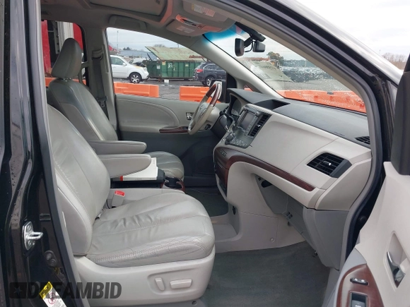 2011 Toyota Sienna XLE AAS with VIN 5TDYK3DC5BS141021, listed as a IAAI auction lot 41538641 with 127,805 mi miles and . Bid and sale history available at DreamBid. Image 5.