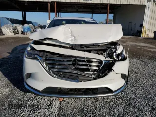 2017 Mazda CX-9 Grand Touring z VIN JM3TCADYXH0127867, wystawiony jako Copart lot #82352204 z przebiegiem 129 349 mil mil oraz Szkoda całkowita • Salvage title. Historia ofert i sprzedaży dostępna na DreamBid. Obrazek 5.