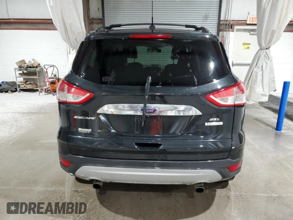 2013 Ford Escape SEL with VIN 1FMCU0H98DUD50796, listed as a Copart auction lot 64014515 with 209,791 mi miles and Salvage title. Bid and sale history available at DreamBid. Image 6.