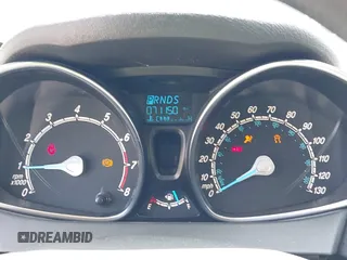2018 Ford Fiesta SE z VIN 3FADP4EJ8JM141067, wystawiony jako IAAI lot #42417301 z przebiegiem 71 150 mil mil oraz . Historia ofert i sprzedaży dostępna na DreamBid. Obrazek 7.