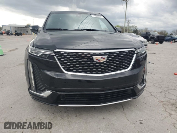 2021 Cadillac XT6 Premium Luxury z VIN 1GYKPCRS1MZ169952, wystawiony jako Copart lot #51908895 z przebiegiem 31 834 mil mil oraz Szkody całkowita. Historia ofert i sprzedaży dostępna na DreamBid. Obrazek 5.