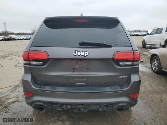 2015 Jeep Grand Cherokee SRT with VIN 1C4RJFDJ8FC752210, listed as a Copart auction lot 45694094 with 76,721 mi miles and Salvage Title. Bid and sale history available at carsss.com. Image 6.