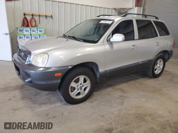 2003 Hyundai Santa Fe GLS z VIN KM8SC13DX3U431975, wystawiony jako Copart lot #56180275 z przebiegiem 239 295 mil mil oraz Czysty tytuł • Clean title. Historia ofert i sprzedaży dostępna na DreamBid. Obrazek 1.
