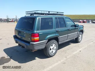 1995 Jeep Grand Cherokee Laredo with VIN 1J4GZ58Y2SC669152, listed as a IAAI auction lot 42077067 with 134,022 mi miles. Bid and sale history available at carsss.com. Image 4.