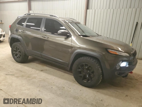2015 Jeep Cherokee Trailhawk z VIN 1C4PJMBS8FW665607, wystawiony jako Copart lot #51536715 z przebiegiem 166 443 mil mil oraz Szkoda całkowita • Salvage title. Historia ofert i sprzedaży dostępna na DreamBid. Obrazek 4.
