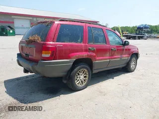 2001 Jeep Grand Cherokee Laredo z VIN 1J4GW48S11C720055, wystawiony jako IAAI lot #42453532 z przebiegiem 158 486 mil mil oraz . Historia ofert i sprzedaży dostępna na DreamBid. Obrazek 4.