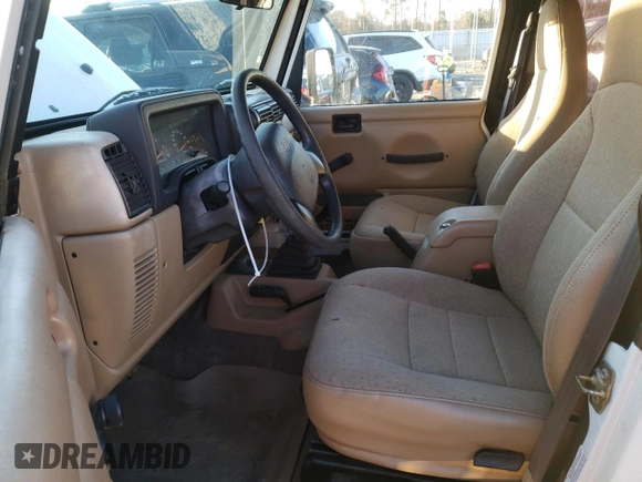 2002 Jeep Wrangler SE with VIN 1J4FA29P82P756330, listed as a Copart auction lot 83659574 with 156,901 mi miles and Salvage Title. Bid and sale history available at DreamBid. Image 7.