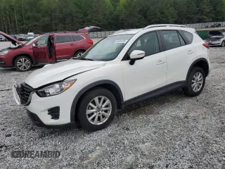 2016 Mazda CX-5 Sport z VIN JM3KE2BY0G0843786, wystawiony jako Copart lot #54451275 z przebiegiem 111 363 mil mil oraz Szkoda całkowita • Salvage title. Historia ofert i sprzedaży dostępna na DreamBid. Obrazek 1.