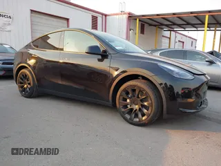 2025 Tesla Model Y Long Range with VIN 7SAYGDED5SF281818, listed as a IAAI auction lot 41302611 with 395 mi miles and . Bid and sale history available at DreamBid. Image 1.