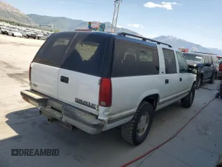 1999 Chevrolet Suburban with VIN 3GNFK16R4XG190883, listed as a Copart auction lot 58324415 with 228,782 mi miles and Salvage title. Bid and sale history available at DreamBid. Image 3.