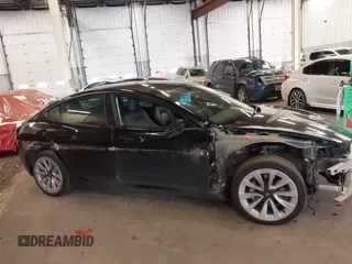 2022 Tesla Model 3 with VIN 5YJ3E1EA4NF187113, listed as a IAAI auction lot 41712331 with 81,879 mi miles and . Bid and sale history available at DreamBid. Image 14.