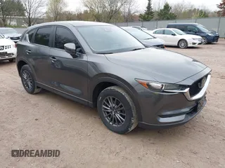 2020 Mazda CX-5 Touring with VIN JM3KFBCM2L0850855, listed as a IAAI auction lot 42147339 with 75,955 mi miles and . Bid and sale history available at carsss.com. Image 1.
