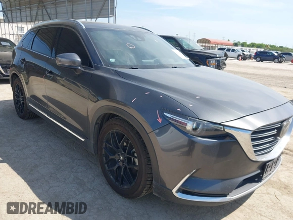 2016 Mazda CX-9 Grand Touring with VIN JM3TCADY5G0120033, listed as a IAAI auction lot 42248488 with 150,044 mi miles and . Bid and sale history available at DreamBid. Image 1.