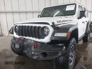 2024 Jeep Wrangler Rubicon with VIN 1C4PJXFG7RW334190, listed as a IAAI auction lot 42332948 with 14,272 mi miles and . Bid and sale history available at DreamBid. Image 6.