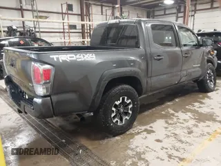 2021 Toyota Tacoma SR z VIN 3TMCZ5AN2MM444249, wystawiony jako IAAI lot #41942146 z przebiegiem 59 429 mil mil oraz . Historia ofert i sprzedaży dostępna na DreamBid. Obrazek 4.