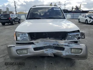 1999 Toyota Land Cruiser with VIN JT3HT05J7X0049786, listed as a Copart auction lot 45527005 with 199,447 mi miles and Salvage Title. Bid and sale history available at carsss.com. Image 5.