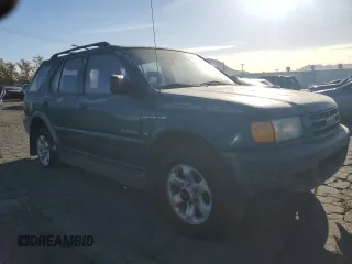 1999 Isuzu Rodeo S with VIN 4S2CK58W1X4349947, listed as a Copart auction lot 84634064 with 135,851 mi miles and Clean Title. Bid and sale history available at DreamBid. Image 4.