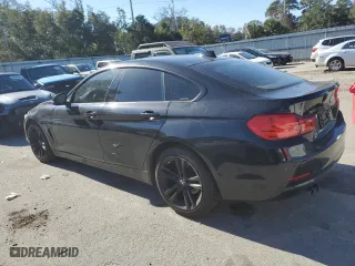 2015 BMW 4 Series 428i xDrive with VIN WBA4C9C51FD331771, listed as a Copart auction lot 82763504 with 124,945 mi miles and Salvage Title. Bid and sale history available at carsss.com. Image 2.