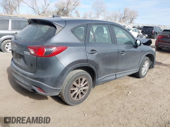 2016 Mazda CX-5 Sport with VIN JM3KE4BY0G0623365, listed as a IAAI auction lot 41525002 with 127,674 mi miles and . Bid and sale history available at carsss.com. Image 4.