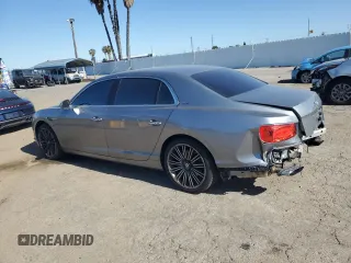 2014 Bentley Flying Spur z VIN SCBEC9ZA7EC090575, wystawiony jako Copart lot #57110315 z przebiegiem 19 083 mil mil oraz Szkoda całkowita • Salvage title. Historia ofert i sprzedaży dostępna na DreamBid. Obrazek 2.