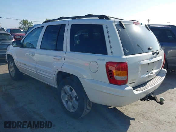 2001 Jeep Grand Cherokee Limited with VIN 1J4GW58S41C615418, listed as a IAAI auction lot 42141143 with 148,145 mi miles. Bid and sale history available at carsss.com. Image 3.