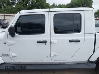 2021 Jeep Gladiator High Altitude with VIN 1C6HJTFG8ML551570, listed as a IAAI auction lot 42229235 with 56,959 mi miles and . Bid and sale history available at DreamBid. Image 15.
