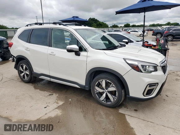 2020 Subaru Forester Touring with VIN JF2SKAXC3LH431111, listed as a Copart auction lot 60539515 with 88,853 mi miles and Salvage title. Bid and sale history available at DreamBid. Image 4.