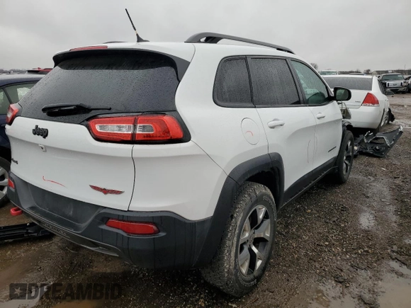 2015 Jeep Cherokee Trailhawk with VIN 1C4PJMBS9FW605075, listed as a Copart auction lot 49256195 with 103,677 mi miles and Salvage Title. Bid and sale history available at DreamBid. Image 3.