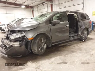 2021 Honda Odyssey Touring with VIN 5FNRL6H82MB025923, listed as a IAAI auction lot 42104290 with 61,178 mi miles and . Bid and sale history available at DreamBid. Image 22.