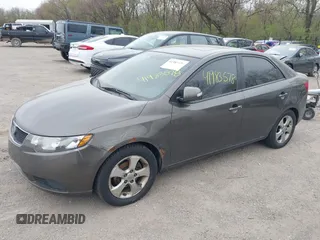 2010 Kia Forte EX with VIN KNAFU4A26A5287755, listed as a IAAI auction lot 41983578 with 273,765 mi miles. Bid and sale history available at carsss.com. Image 2.