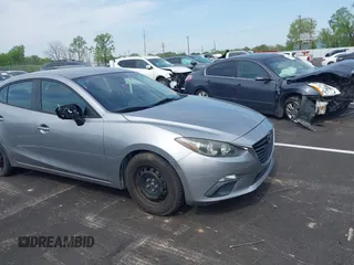 2014 Mazda 3 i SV with VIN JM1BM1T73E1171466, listed as a IAAI auction lot 41999827 with 157,739 mi miles and . Bid and sale history available at DreamBid. Image 1.