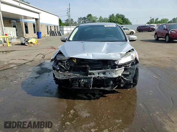2015 Ford Focus SE with VIN 1FADP3F2XFL321208, listed as a Copart auction lot 61413005 with 139,439 mi miles and Salvage title. Bid and sale history available at DreamBid. Image 14.