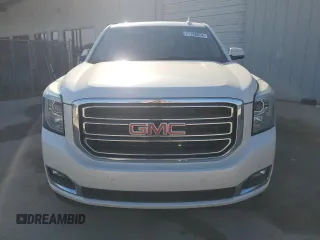 2015 GMC Yukon SLT with VIN 1GKS1BKCXFR563509, listed as a Copart auction lot 77188854 with 127,481 mi miles and Clean Title. Bid and sale history available at carsss.com. Image 5.