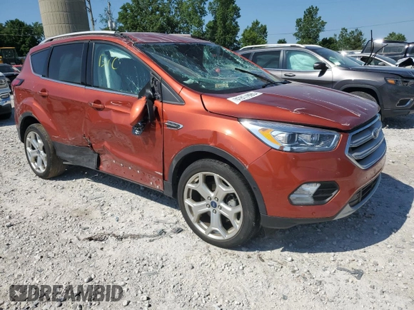2019 Ford Escape Titanium z VIN 1FMCU9J90KUC24993, wystawiony jako Copart lot #61917895 z przebiegiem 57 101 mil mil oraz Czysty tytuł • Clean title. Historia ofert i sprzedaży dostępna na DreamBid. Obrazek 4.