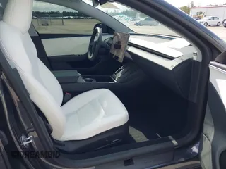 2025 Tesla Model 3 Long Range with VIN 5YJ3E1EA7SF940208, listed as a IAAI auction lot 42433793 with 1,983 mi miles and . Bid and sale history available at DreamBid. Image 5.