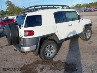 2014 Toyota FJ Cruiser with VIN JTEBU4BF1EK183485, listed as a IAAI auction lot 41185853 with 91,293 mi miles. Bid and sale history available at carsss.com. Image 4.