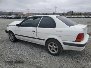 1996 Toyota Tercel DX z VIN JT2AC52L5T0145290, wystawiony jako Copart lot #45027855 z przebiegiem 186 673 mil mil oraz Szkoda całkowita • Salvage title. Historia ofert i sprzedaży dostępna na DreamBid. Obrazek 2.