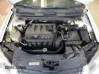 2014 Chrysler 200 LX z VIN 1C3CCBAB7EN124877, wystawiony jako Copart lot #57773115 z przebiegiem 143 023 mil mil oraz Szkody całkowita. Historia ofert i sprzedaży dostępna na DreamBid. Obrazek 11.