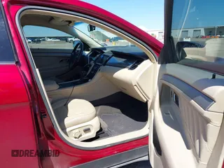 2013 Ford Taurus SEL with VIN 1FAHP2E8XDG231807, listed as a IAAI auction lot 41774166 with 120,639 mi miles and . Bid and sale history available at carsss.com. Image 5.