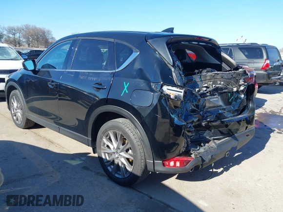 2021 Mazda CX-5 Grand Touring with VIN JM3KFADM1M0406098, listed as a IAAI auction lot 41654735 with 33,050 mi miles. Bid and sale history available at carsss.com. Image 3.