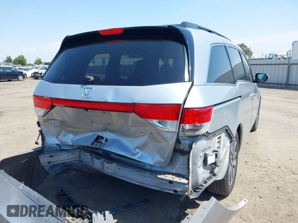 2014 Honda Odyssey Touring with VIN 5FNRL5H91EB068427, listed as a IAAI auction lot 42163315 with 184,134 mi miles and . Bid and sale history available at DreamBid. Image 4.