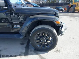 2023 Jeep Wrangler 4xe Sahara with VIN 1C4JJXP62PW613040, listed as a IAAI auction lot 41489171 with 36,818 mi miles. Bid and sale history available at carsss.com. Image 19.