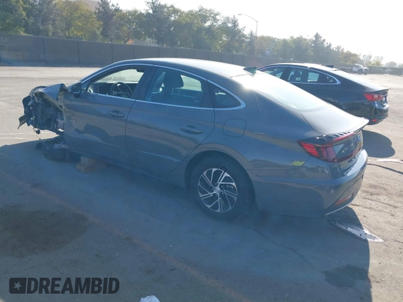 2022 Hyundai Sonata Hybrid Blue with VIN KMHL24JJ1NA041773, listed as a IAAI auction lot 41043553 with 23,696 mi miles. Bid and sale history available at carsss.com. Image 3.