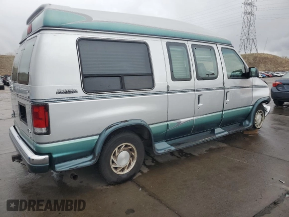 1999 Ford Econoline Cargo Recreational with VIN 1FDRE14L3XHA31771, listed as a Copart auction lot 49973795 with 220,268 mi miles and Salvage title. Bid and sale history available at DreamBid. Image 3.