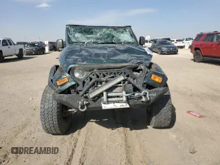 2005 Jeep Wrangler SE with VIN 1J4FA29175P331391, listed as a Copart auction lot 76608824 with 98,268 mi miles and Salvage Title. Bid and sale history available at carsss.com. Image 5.