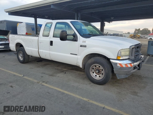 2002 Ford F-250 XL with VIN 1FTNX20F22ED31685, listed as a Copart auction lot 83911384 with 276,778 mi miles and Salvage title. Bid and sale history available at DreamBid. Image 4.